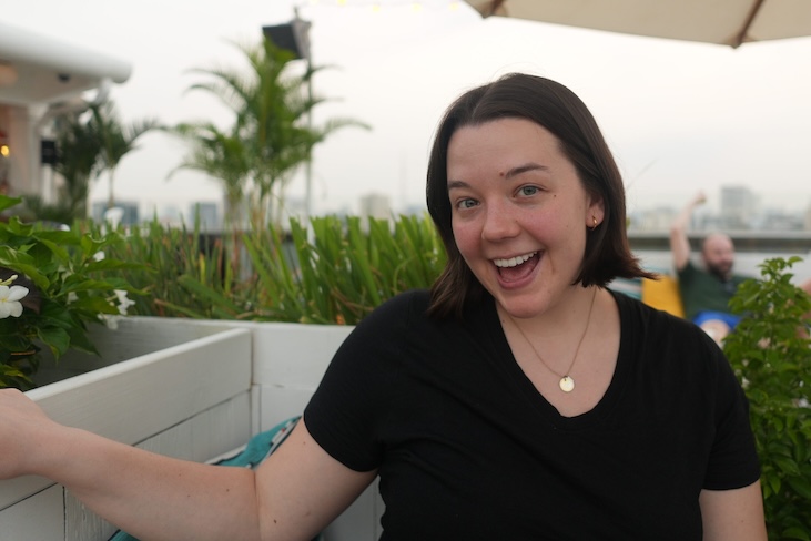 Tanya sitting in a rooftop bar in Ho Chi Minh City, Vietnam