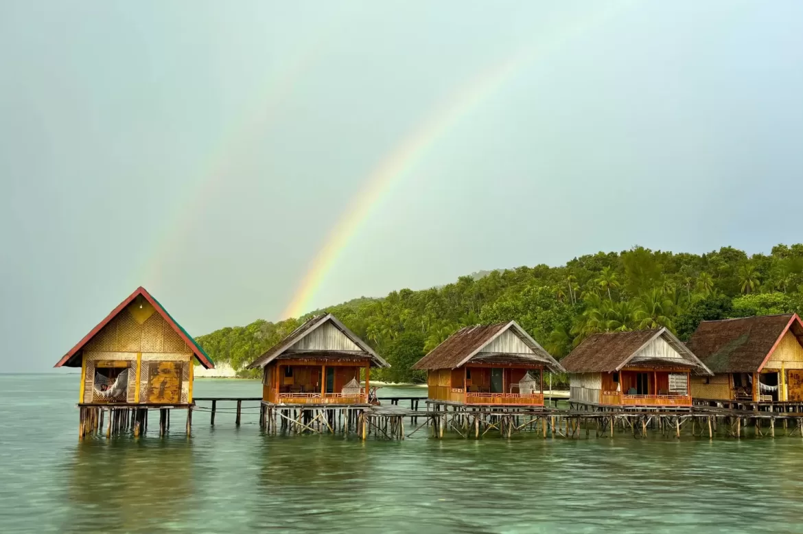 Raja Ampat Kri Yenbuba Homestay after a rain, two rainbows can be seen over the over-the-water bungalows